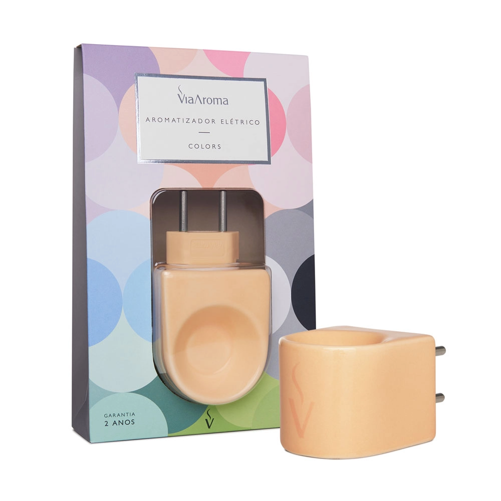 O Difusor Aromatizador Elétrico Bivolt Pêssego Via Aroma da Linha Colors facilita a difusão de óleos essenciais e essências com praticidade, economia e segurança. Feito de porcelana colorida para trazer mais descontração e vivacidade ao seu espaço, é uma invenção original da Via Aroma.